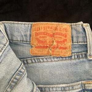 Levi's 512 Light Wash Distressed Jeans - Men's Size 31x32